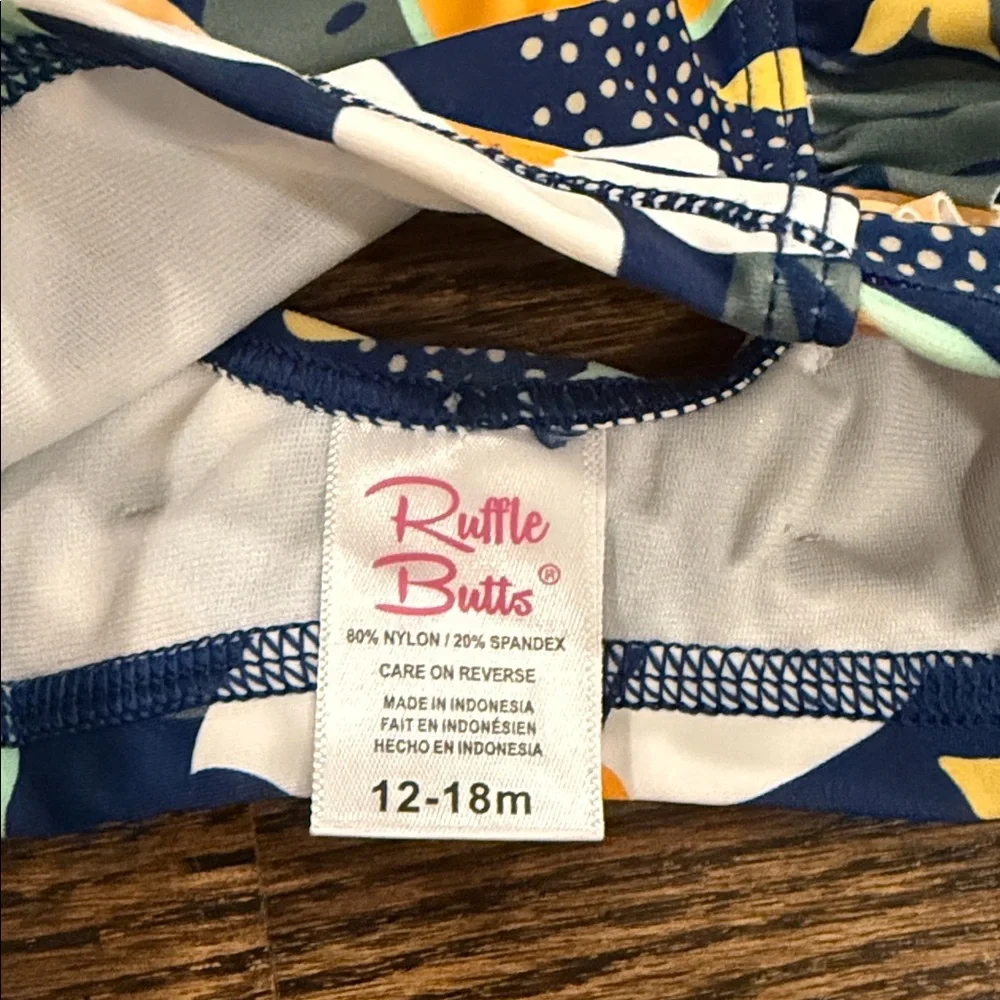 Ruffle Butts Navy Waterfall Bikini Into the Tropics Print 12-18 Months